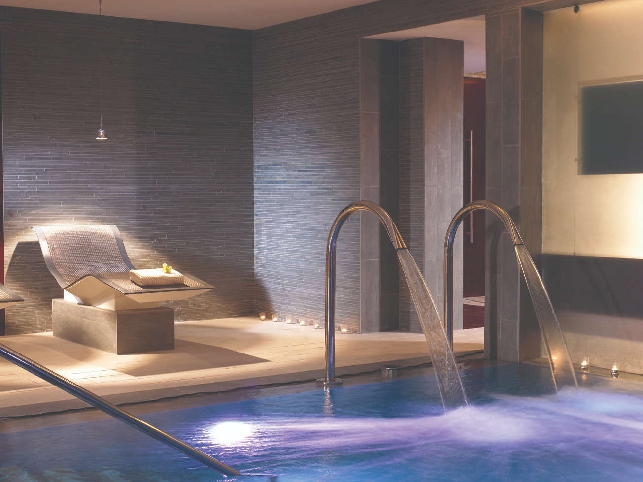 Calm indoor pool with spa facilities